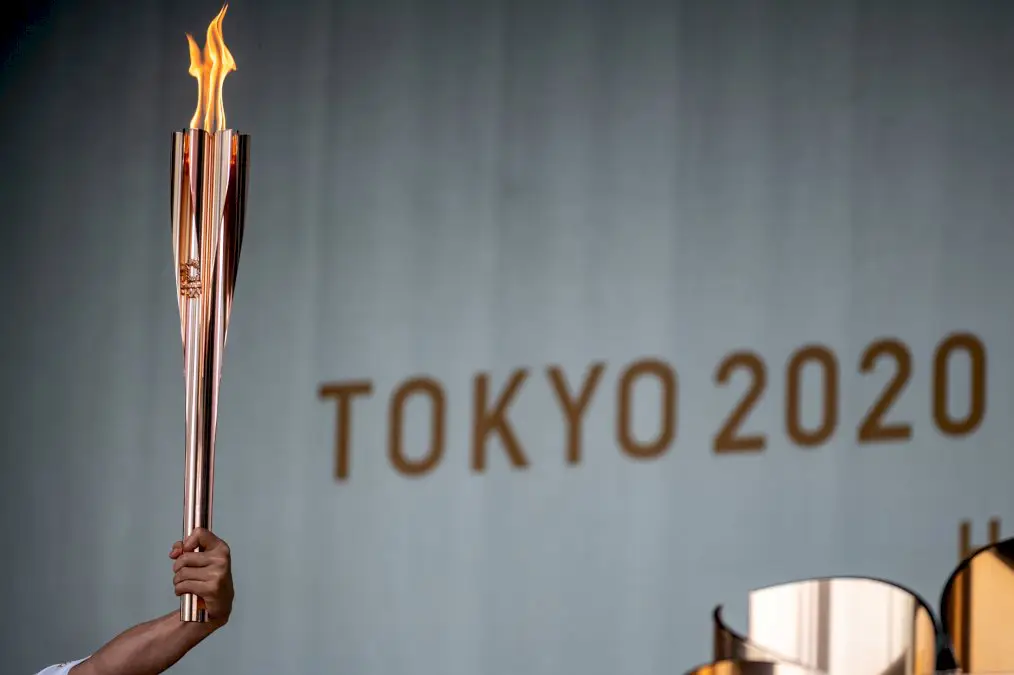 jo-2020:-la-flamme-olympique-arrive-a-tokyo-dans-une-ambiance-morose